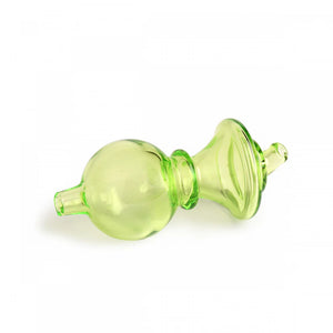 Green glass stopper on a white background