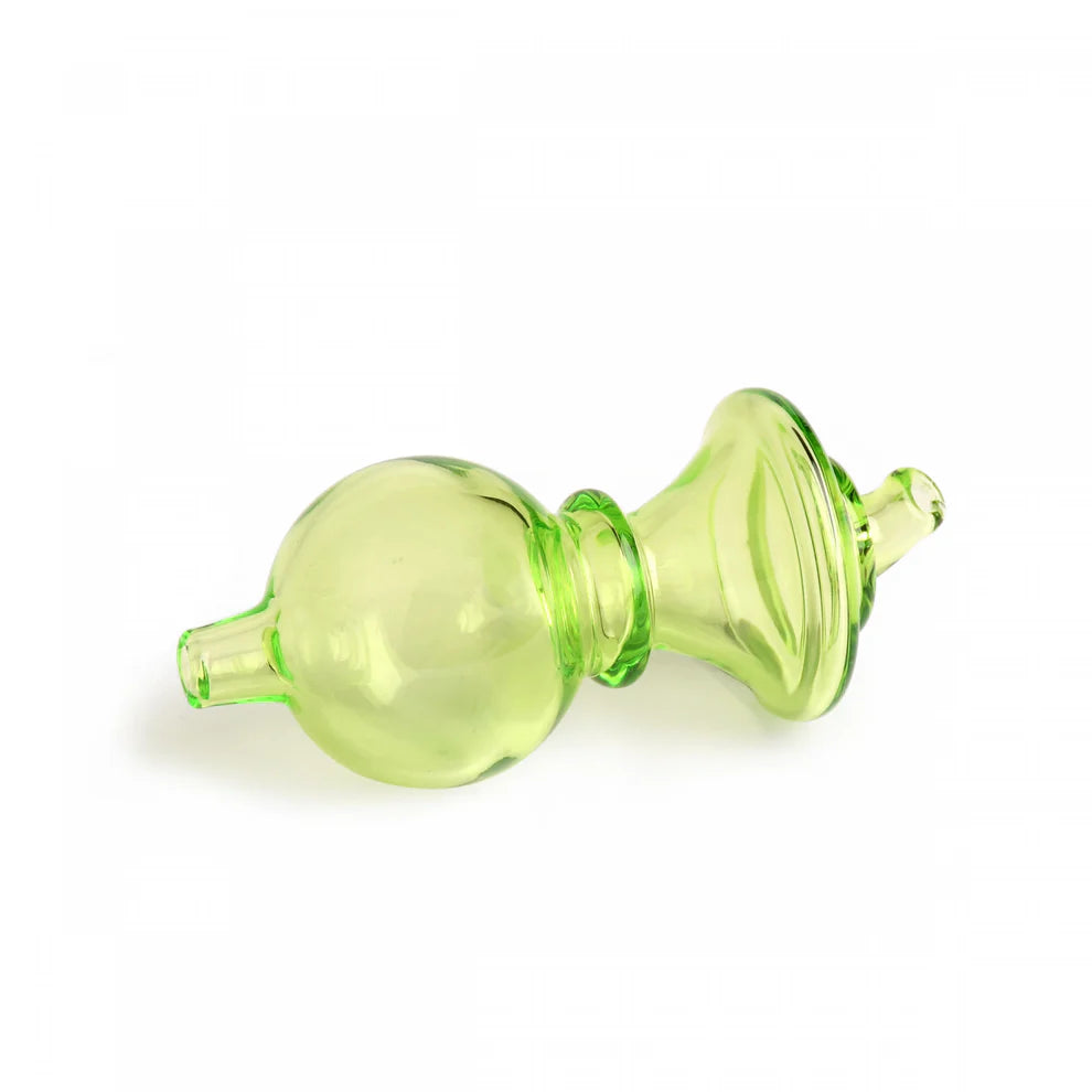 Green glass stopper on a white background