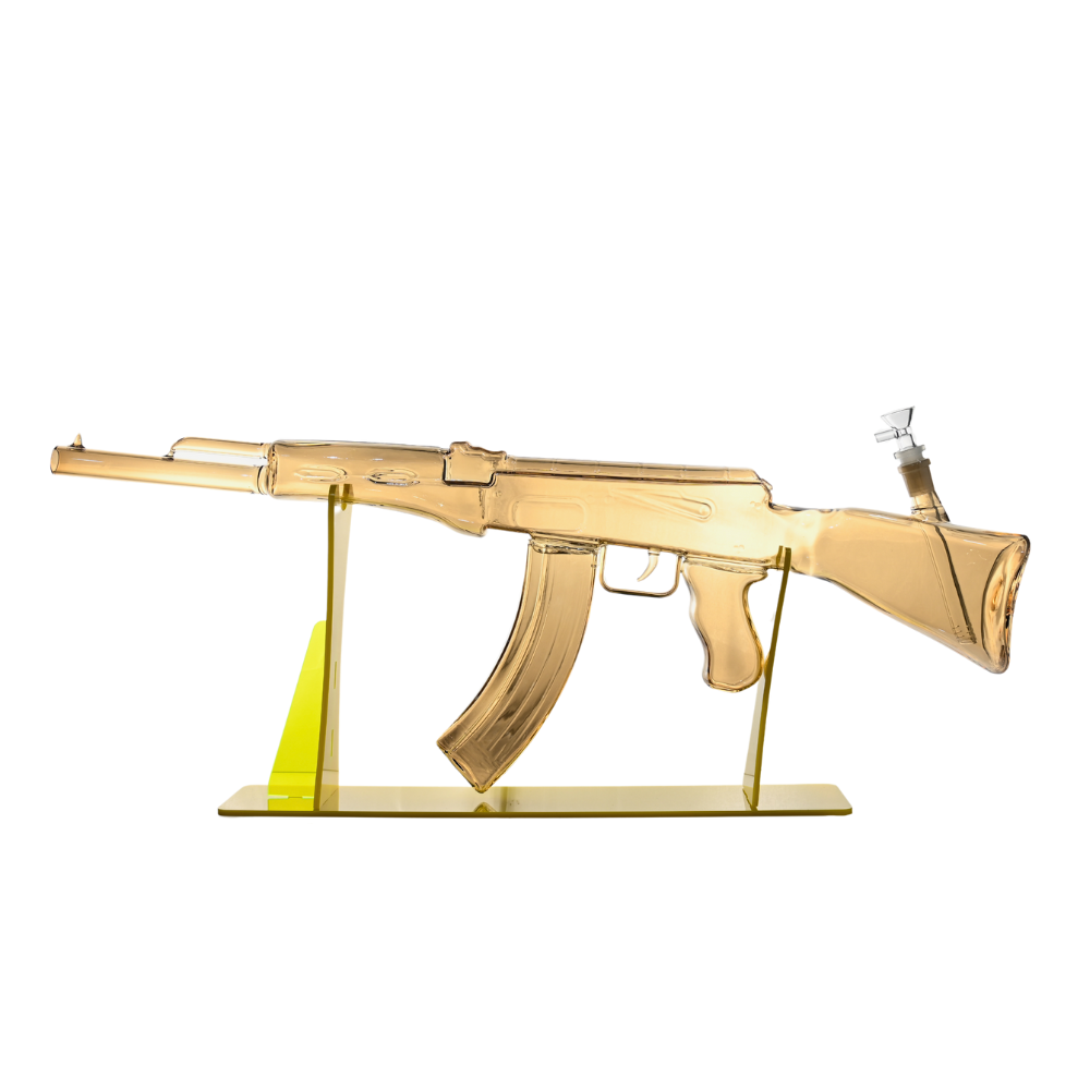 Gold-colored rifle model on a white background