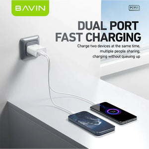 Bavin dual port fast charging device with two smartphones being charged.