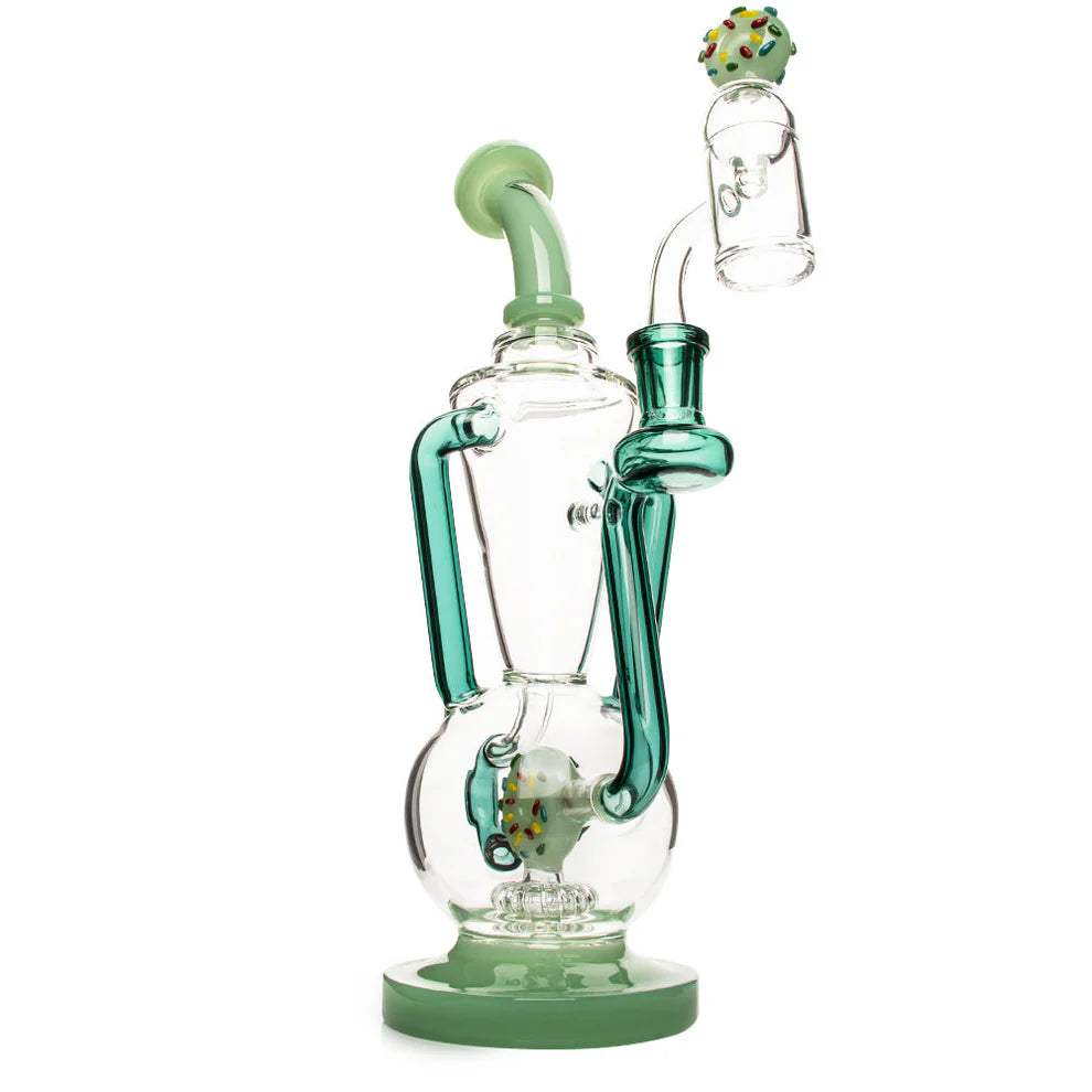 Glass smoking device with green accents on a white background