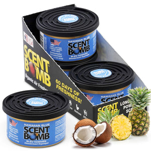 Scent Bomb air fresheners with packaging, pineapple, coconut, and pineapple slices on a white background