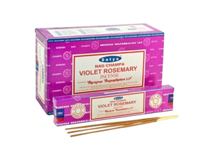 Purple boxes of Satya Nag Champa Violet Rosemary incense with incense sticks on a white background