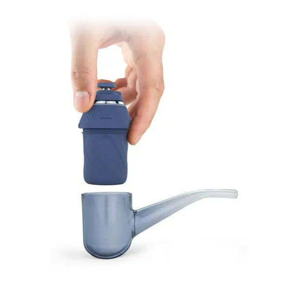 A smart wax pen with a modular design, displayed in an open case, revealing its components including a ceramic bowl, a USB-C charging cable, and other accessories.