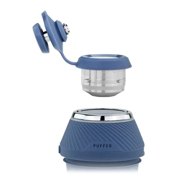 A smart wax pen with a modular design, displayed in an open case, revealing its components including a ceramic bowl, a USB-C charging cable, and other accessories.